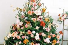 41 a beautiful Christmas tree with orange, rust, burgundy, blush and pink blooms, some branches and leaves is a very cute and romantic idea