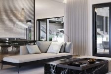 41 an elegant contemporary living room accented with a black marble slab table that brings ultimate luxury