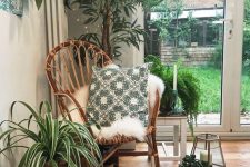 45 a pretty biophilic nook with a potted tree and various potted plants around just one rattan chair to turn this nook into a relaxing one