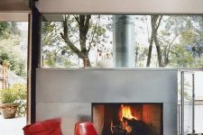 a fireplace clad with galvanized steel for a modern space looks lightweight and chic and cozies up a space