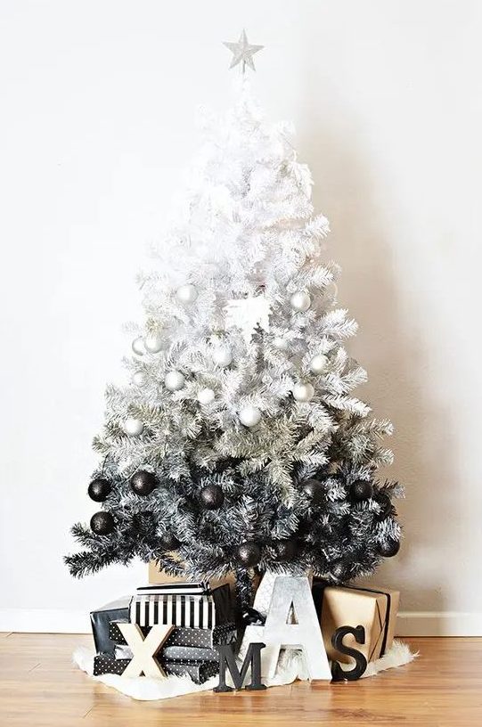 a gorgeous ombre white to black Christmas tree with perfectly matching ornaments and Xmas letters under the tree is a bold idea