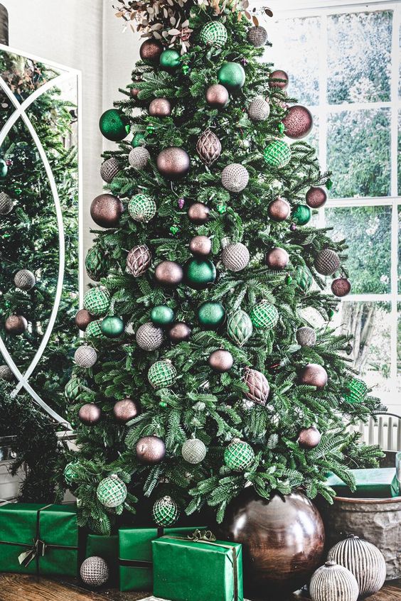 a green Christmas tree with brown and green ornaments and leaves on top is cool for the holidays