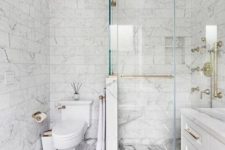 a neutral bathroom design with lots of marble
