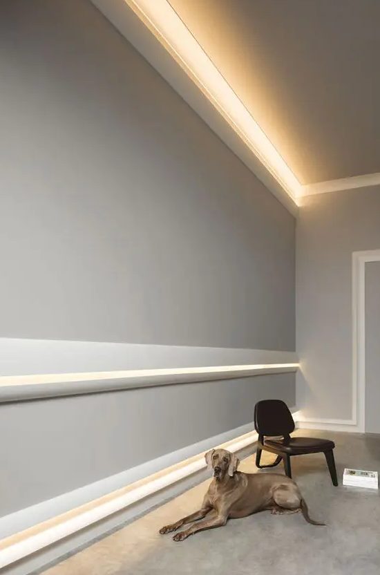 a neutral contemporary interior accented with crown molding and with indirect light over it is a very cool idea