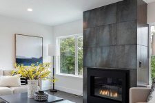 a neutral living room design with a metal fireplace