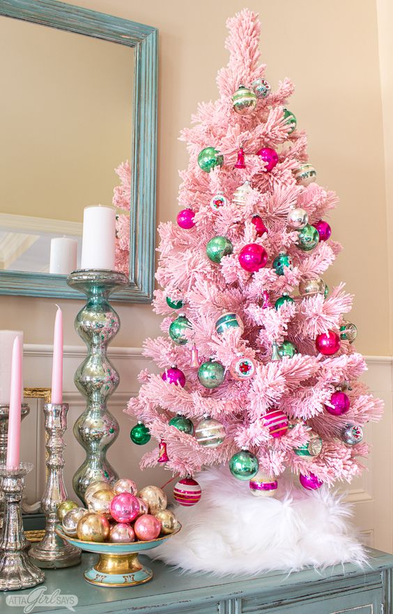 a pink Christmas tree decorated with green and hot pink vintage ornaments is a pretty alternative to a usual large one