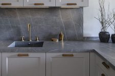 a marble kitchen backsplash looks great with grey kitchen cabinets