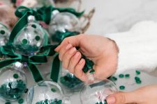 cool glam Christmas ornaments filled with emerald jewels and matching velvet ribbon bows are amazing for stylish decor