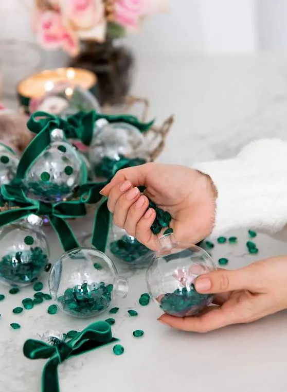 cool glam Christmas ornaments filled with emerald jewels and matching velvet ribbon bows are amazing for stylish decor