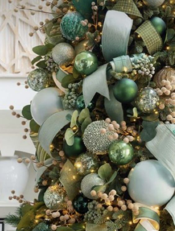 light green and green ribbons and matching ornaments plus berries for super lush and colorful Christmas decor