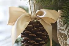 pinecones are great Christmas tree ornaments that are really easy to make – just add a bow and voila