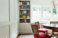 wainscoting on the walls and crown molding that perfectly matches in color and makes the space look neater and more eye-catching