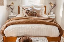 18 a lovely boho bedroom done in warm neutrals, a rich-stained bed with neutral and earthy bedding, hanging shelves and floating nightstands