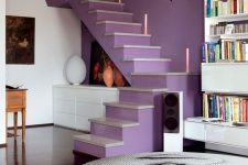 20 a contemporary space with a very peri staircase for an accent and neon lights, a bold photo coffee table and a bookcase