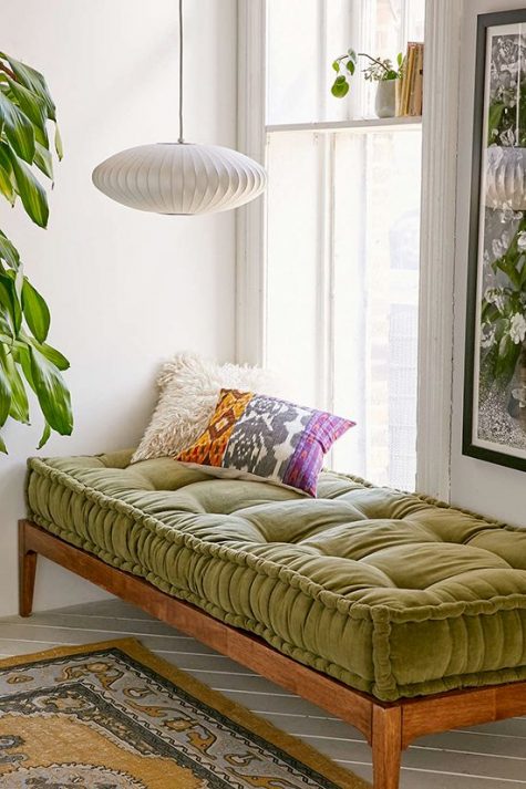 a cozy daybed by the window with a mattress of warma nd textural fabric is a chic and cool idea to rock
