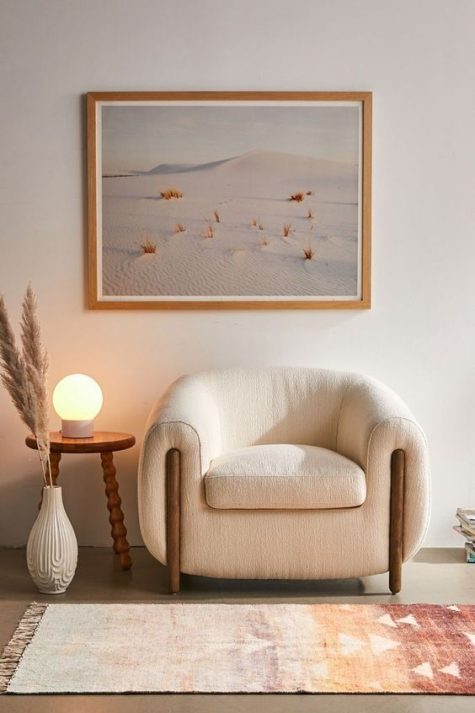 a lovely textural creamy chair with wooden legs is a cool idea for two reasons – it’s curved, which is a trend, it’s textural, which is another trend