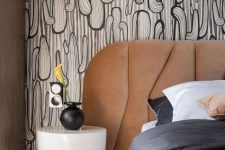 31 such a textural headboard will make your bedroom more eye-catchy, especially if you go for some bold printed wallpaper like this one