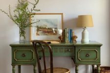 40 a vintage green desk with touches of gold and a matching vintage chair for a refined and chic work space