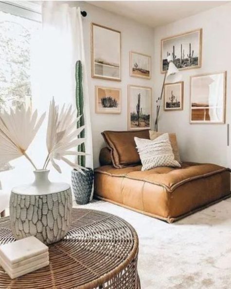 a cozy reading nook with a desert gallery wall and a brown leather daybed in the corner – a favorite piece with much comfort provided