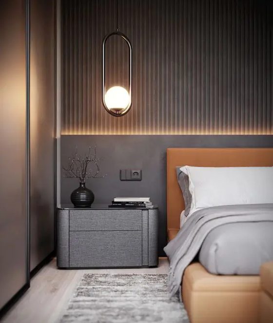 a modern bedroom with a stylish wood accent wall