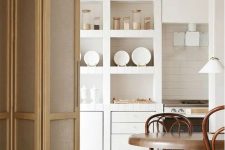 a creative small kitchen with a large wall unit