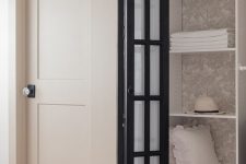 add a black frame French folding door to hide your closet or another built-in storage space with style