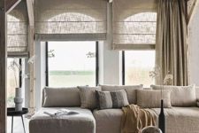 an all-neutral space with semi-sheer shades and curtains that match in color and don’t break the harmony of this space