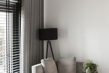 black blinds and grey curtains are a great combo for a minimalist or contemporary space, a very functional and stylish one