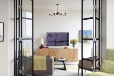 black frame glass folding doors like these ones break up the space without diminishing light and sight lines and make it airy