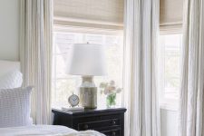 neutral woven blinds add texture to the space and creamy curtains are perfect for adding elegance to the room
