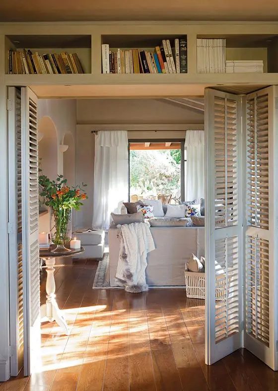 white shutter folding doors perfectly match the modern farmhouse style and delicately decorate the spaces