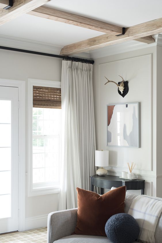 woven shades and white draperies are a great combo to add interest and coziness to any room easily