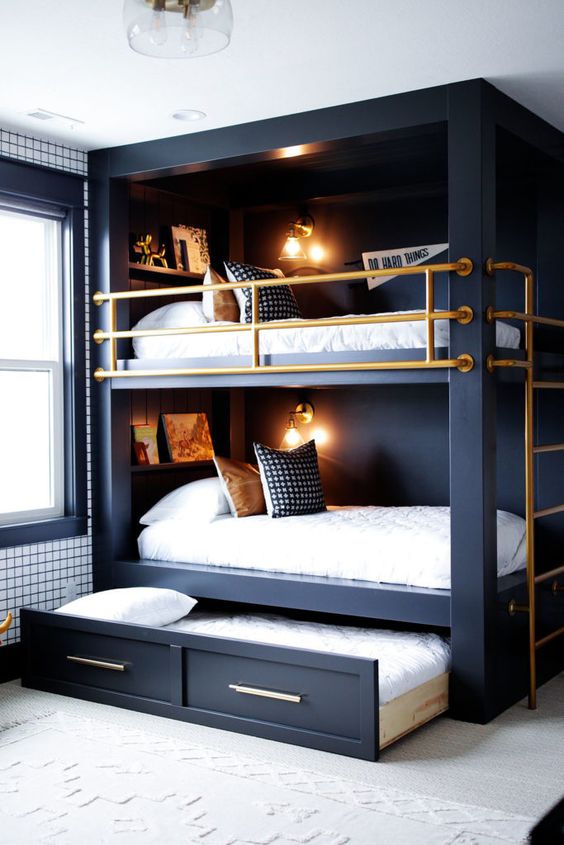 a cool modern bedroom in black and white, with a bunk bed and a storage drawer under the lower one to store various stuff
