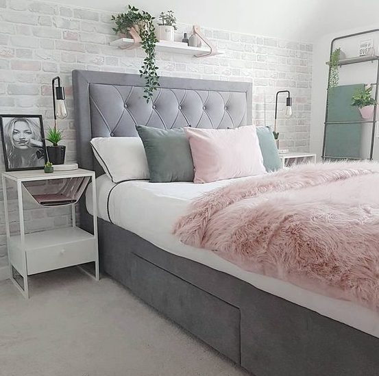 a grey upholstered bed with a single drawer for storing things is a lovely idea for a modern space