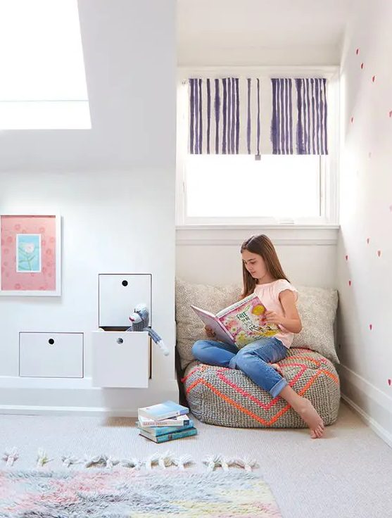 an awkward nook in a kids' room can be used as a cozy reading space with bean bag chairs