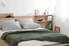12 a minimalist light-stained bed with side drawers and an open storage compartment at the foot of the bed plus storage nightstands is a cool solution for a small bedroom