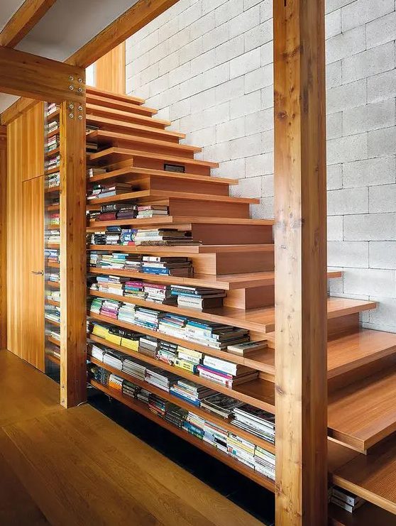 a contemporary light stained staircase that includes enough space for storing books due to the two sided steps