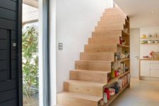 26 a practical staircase with open shelves for books and for displaying various objects is a very cool and up-to-date idea