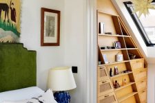 34 an attic nook taken by a large and elegant stained wood storage unit with lots of shelves and drawers is a smart idea