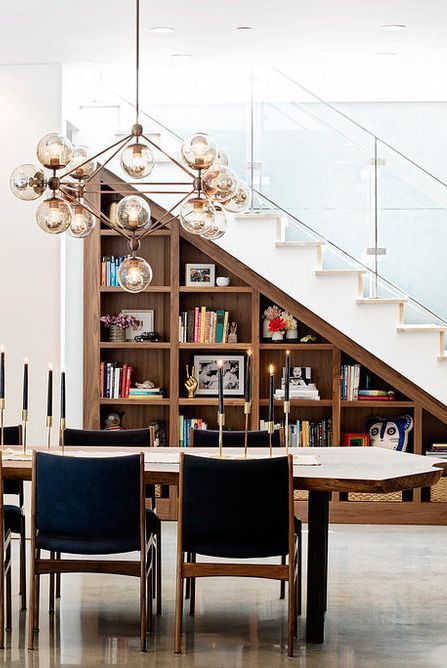 built in bookshelves under the stairs are always a good idea, they let you use more space and decorate the room