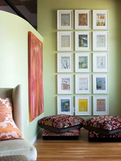 a pretty nook with a grid gallery wall and some bright cushions on the floor is a lovely space to enjoy your art