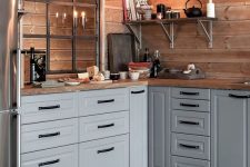 a cozy Scandi kitchen with a planked wood wall