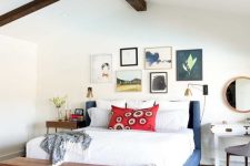 a cute bedroom with a lovely gallery wall