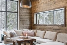 a cozy chalet living room design with wood walls