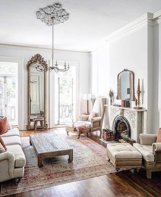 a chic ornate fireplace is a statement feature in the room and it makes the space cooler and bolder