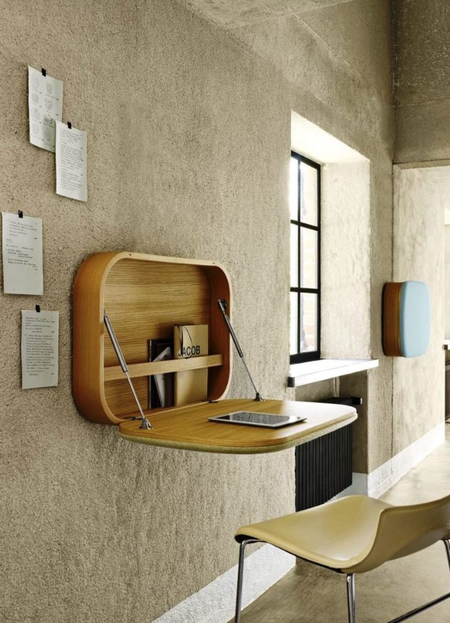 a chic wooden Murphy desk with curved angles and some storage for notebooks inside is a stylish option