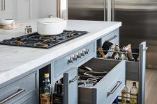 a lovely slate grey kitchen island with drawers for storage and a built-in cooker is a lovely idea with much function