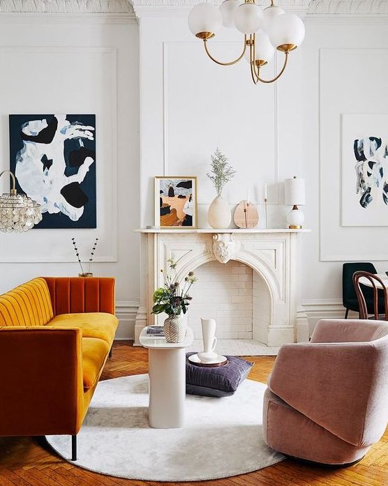 a more contemporary version of a fireplace matches the mid-century modern French chic living room