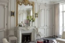 molding on the walls, doors, ceiling trim and even to highlight the fireplace compose a very chic French style space