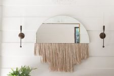 03 a half circle mirror with long blush fringe is a cool idea for a boho entryway like this one